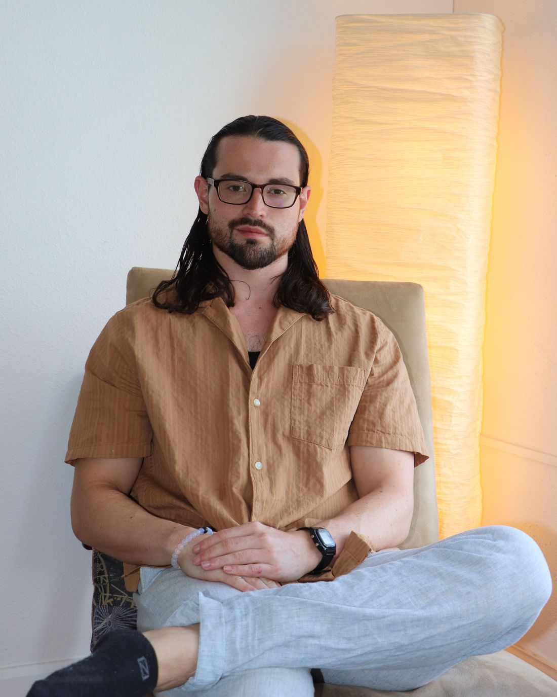 Anthony Sosa seated in a softly lit therapy room